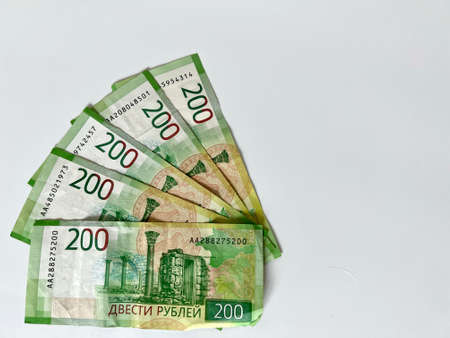 Fan of two hundred rubles banknotes. Russian currency on white background. Money background and texture. Image with selective focusの写真素材