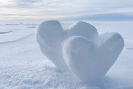 two hearts made of snow. High quality photoの写真素材