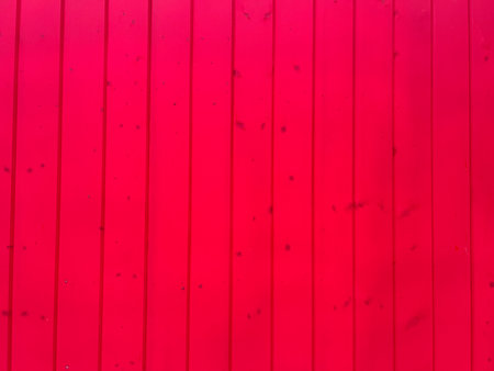 dyed red color wood planks texture, background. house exterior decorationの写真素材