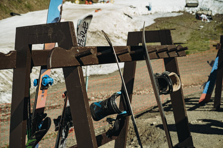 wooden stand with snowboard and ski on mountain resort. High quality photoの写真素材