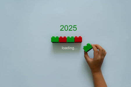Loading new year 2024 to 2025 with child hand putting green plastic block in progress bar. Start new...