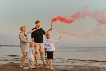 Gender reveal announcement on the beach. Loving family expecting baby girl. Happy moments. High quality photoの写真素材