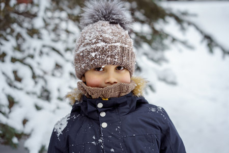little caucasian boy on snowy winter day. High quality photoの写真素材