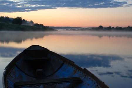 fishing boat on sunsetの写真素材