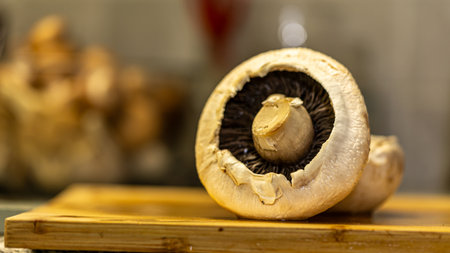 mushroom champignon on a cutting board in the kitchenの写真素材