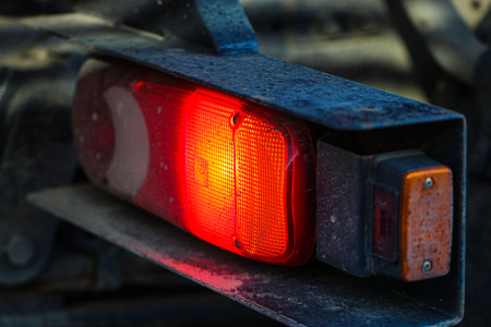 Close-up of a red light on the back of a car