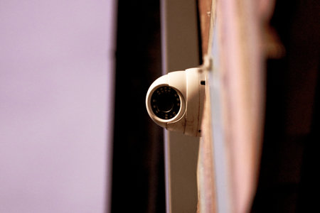 CCTV security camera on the wall. Security camera in the room.