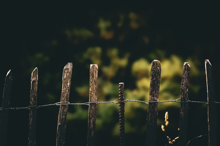 wooden fence in front of a blurred background, retro tonedの写真素材