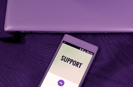 Mobile phone with support on violet optic, with notebook