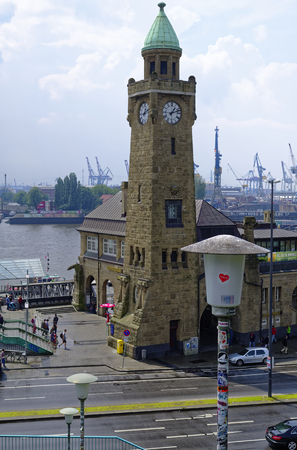 historic harbor in Hamburg with ships and docks in the background and harbor facility with belfry in Germany Europe on 11 July 2017のeditorial素材