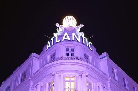 Entrance of prestigious Hotel Atlantic in Hamburg Germany Europe with pages in the night one day after the end of the G20 summit in Hamburg on 09 July 2017のeditorial素材
