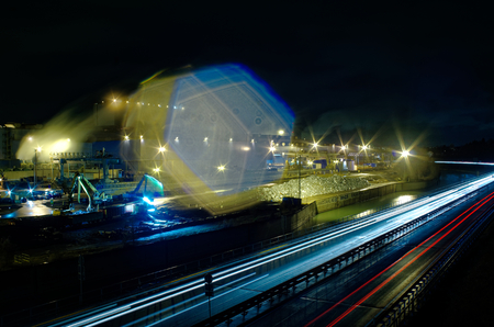 Steel hat of the Saarstahl AG at Voelklingen, Saarland, Germany at night in the foreground of the a620 and the river Saar, the photo shows the production of steel from scrap loaded railway wagons, taken on March 08, 2018のeditorial素材