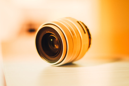 White lens fixed focal length with exposed background and warm colorsの写真素材