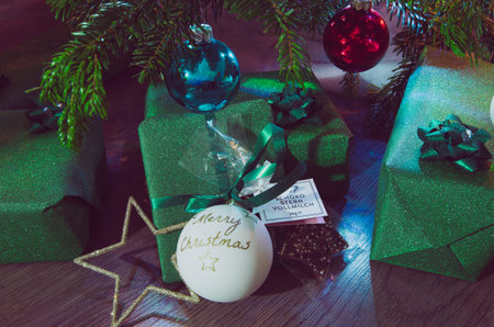 Christmas bauble on a Christmas tree and glowing lights