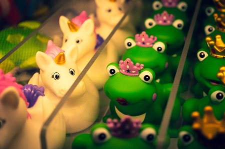 Unicorn and frog different bathing ducksの写真素材