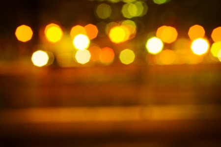 Background of a street with lights at night out of focusの写真素材