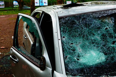Car in which the disc was hit and all internal parts were stolen with broken glass and broken discの写真素材