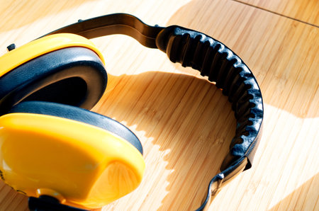 yellow earmuffs to clarify construction noise and noise