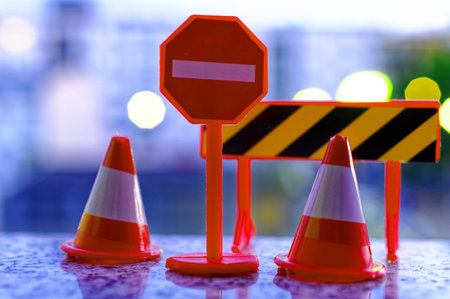 Toy with traffic sign passage prohibited and pylons at nightの写真素材