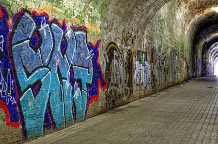 Station tunnel Luetzelbachtunnel in the station district Saarbruecken Saarbrooklyn with graffiti photographed on 2015-03-15のeditorial素材