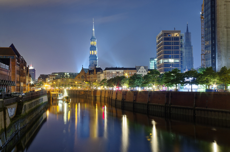 Hamburg Customs Canal with St. Catherine's Church and bridge in the background at night photographed an 2016.08.28のeditorial素材