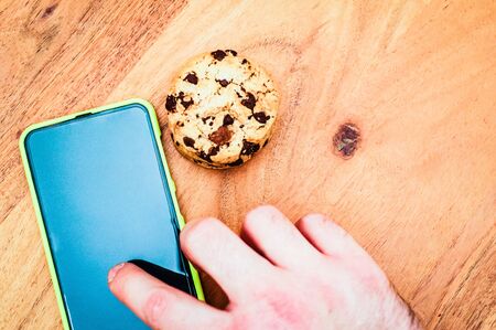 Accept cookies with a tablet to illustrate cookie banners for websites with cookiesの写真素材