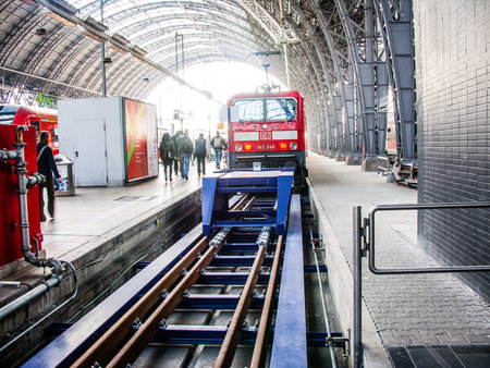 Frankfurt Hauptbahnhof interior view with railroad tracks and trains photographed on 03.15.2011