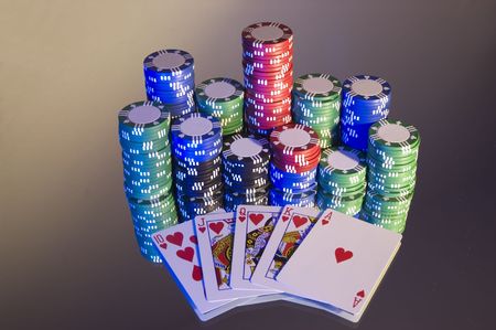 Royal Flush, hearts, with poker chips, left hand blue lighting on mirror.のeditorial素材