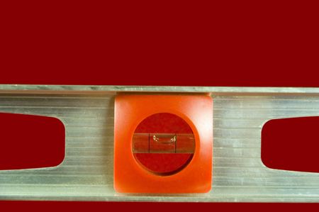 A level tool set against a red background.の写真素材