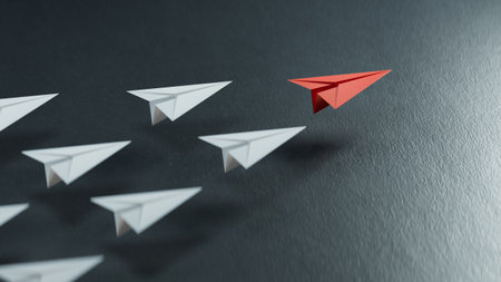 Successful Leadership Concept Red leader paper planes and followed by white planes. Strategic planning development.3D rendering on black background.の写真素材