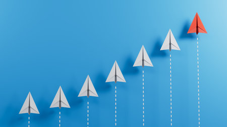 Leaderairplane concept with red paper plane leading among white on blue background with copy...