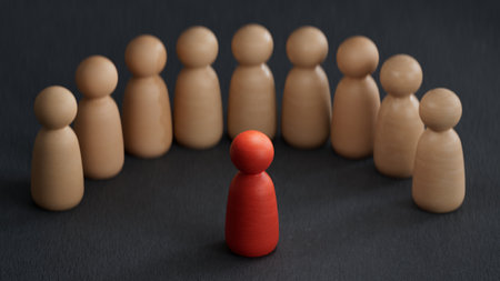 Wooden figures of people on a black background. The concept of leadership and teamwork.の写真素材