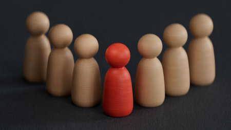 Wooden figures of people on a black background. The concept of leadership.の写真素材