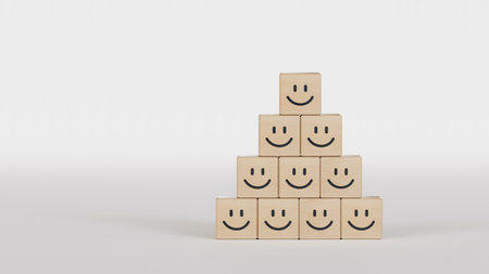 3D rendering of a pile of wooden cubes with smileys in front of a white backgroundの写真素材