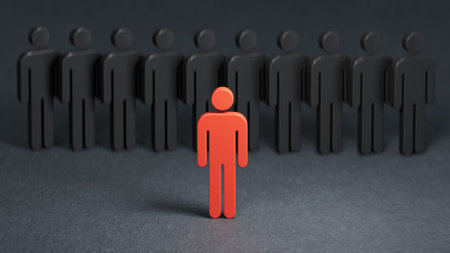 Leadership concept with red man standing out from crowd of black people