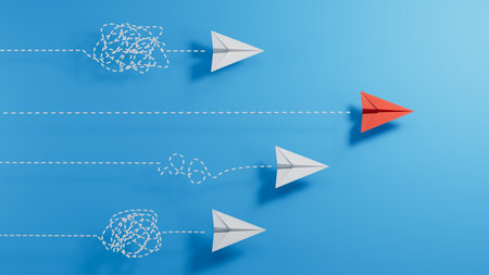 Leadership concept with red paper plane leading among white paper planes on blue backgroundの写真素材