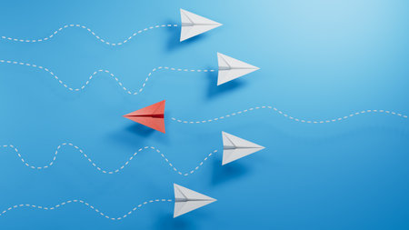 Leadership concept with paper plane leading among white ones on blue backgroundの写真素材