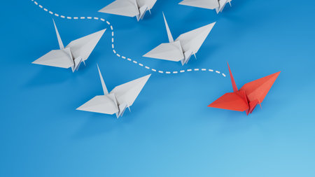 group of blue paper swans are sailing in one direction, one red is sailing in the opposite...