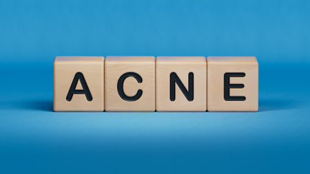 ACNE. Text abbreviation on wood cubes blocks. Most commonly diagnosed mental disorder of childrenBusiness Concept.3D rendering on blue background.の写真素材