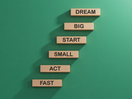 Dream Big Start Small Act Fast symbol. Concept words Dream Big Start Small Act Fast on wooden blocks.Business concept.3D rendering on green background.の写真素材