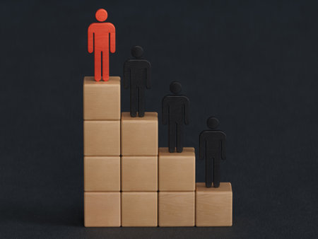 red wooden man piece on top of ladder on black background. Climbing Stairs success business leadership career growth opportunities performance progression step concept.の写真素材