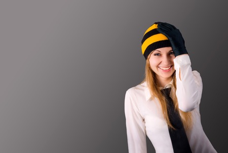 Pleasantly surprised young girl holding hand on headの写真素材