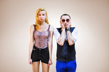 Young couple looking very amazed and surprised