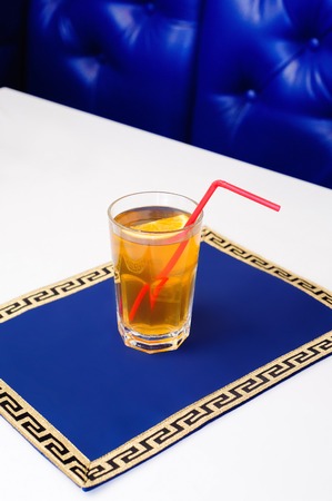 Cold orange lemonade in  glass with a slice of  lemonの写真素材