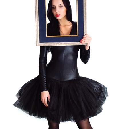 Woman wearing in black dress holding picture frame, Isolateの写真素材