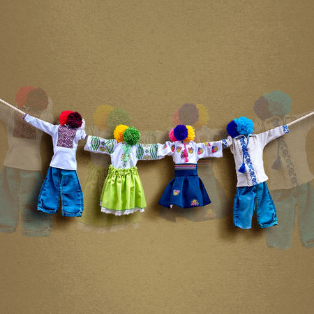 Handmade ukrainian textile dolls on background, traditional folk rag doll Motanka in ethnic style, ancient culture folk crafts tradition of Ukraine. Most Popular Souvenirs From Ukraine.の写真素材
