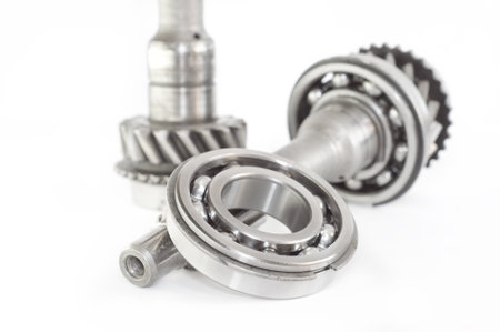 stainless bearing, shaft and cogwheel isolated on white background 