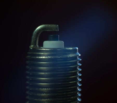 spark plug on black background