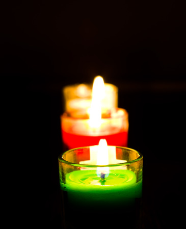 Burning colored candles の写真素材