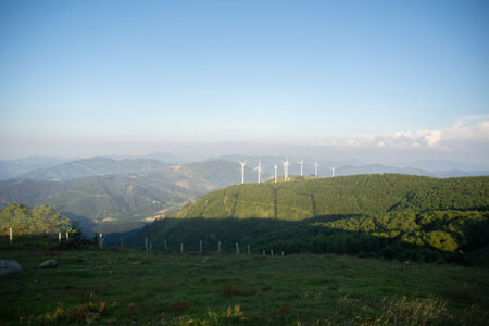 wind generators in the mountains at sunsetの写真素材